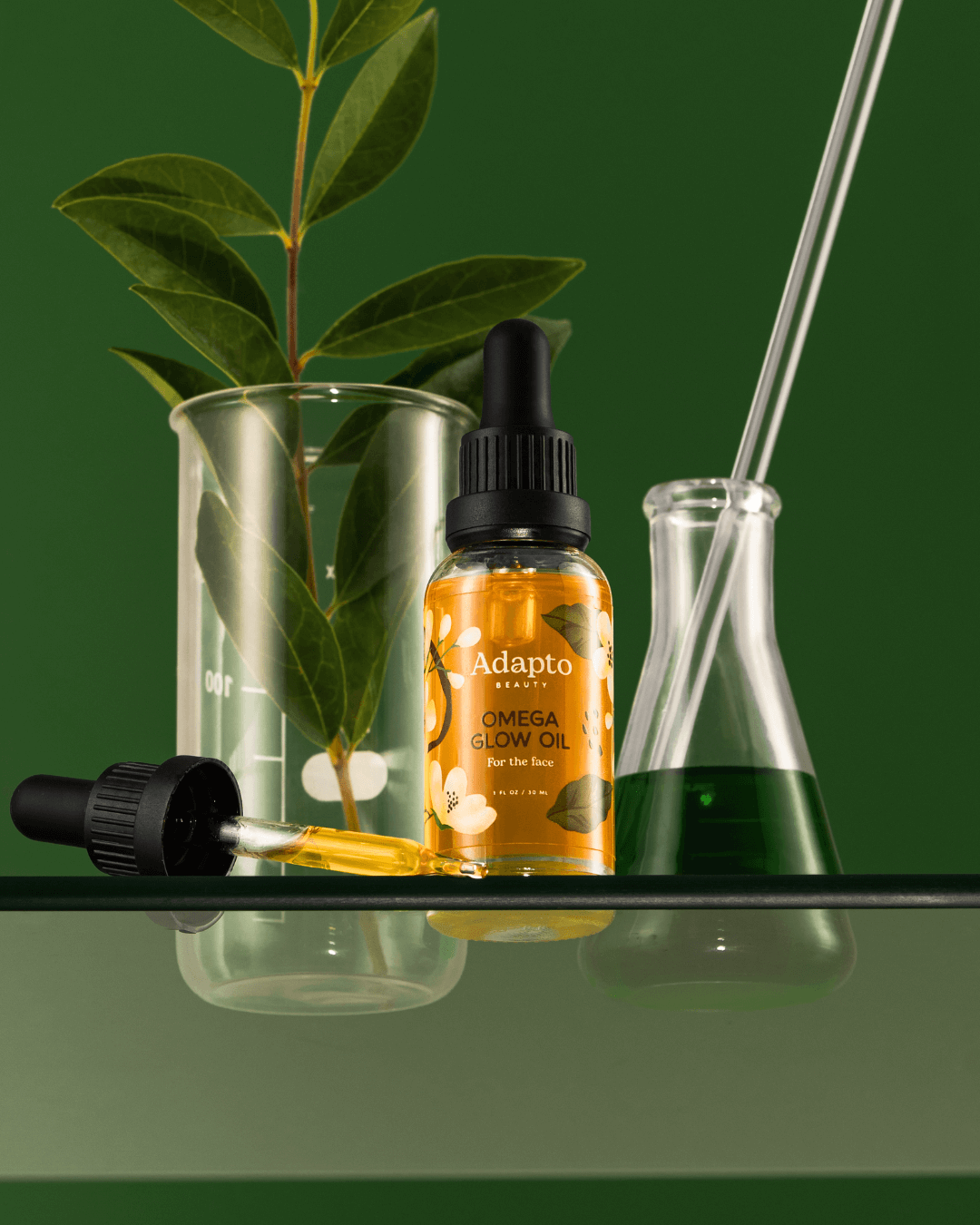 Adapto Beauty Omega Glow Oil with its lightweight, fast-absorbing texture, formulated for radiant skin, barrier repair, and antioxidant protection